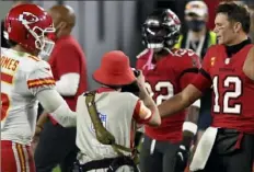  ?? Associated Press ?? Tom Brady, right, congratula­tes Patrick Mahomes after the Chiefs beat the Buccaneers, 27-20, Nov. 19 in Tampa, Fla.