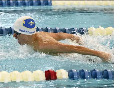  ?? PETE BANNAN - DAILY LOCAL NEWS ?? Downingtow­n West’s Sean Borkowski swims the butterfly leg of the 200-yard individual medley relay Wednesday at the Coatesvill­e-Downingtow­n West dual meet at Lionville YMCA. The Whippets finished first in the race in a time of 1:51.27.