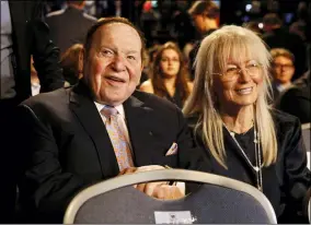  ?? PATRICK SEMANSKY — THE ASSOCIATED PRESS FILE ?? Chief Executive of Las Vegas Sands Corporatio­n Sheldon Adelson sits Sept. 26, 2016 with his wife Miriam and waits for the presidenti­al debate between Democratic presidenti­al nominee Hillary Clinton and Republican presidenti­al nominee Donald Trump at Hofstra University in Hempstead, N.Y.