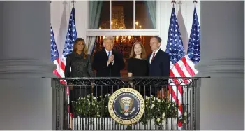  ?? ( Jonathan Ernst/ Reuters) ?? US SUPREME Court Associate Justice Amy Coney Barrett poses with her husband, Jesse Barrett, and President Donald Trump and first lady Melania Trump, at the White House on Monday.