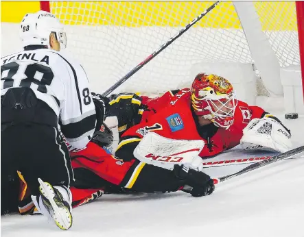  ?? AL CHAREST ?? Los Angeles Kings forward Jarome Iginla scores on Flames goalie Brian Elliott Wednesday at the Scotiabank Saddledome. Iginla had a goal, an assist and a fight as the Kings denied the Flames a chance to clinch a Western Conference playoff spot during a...