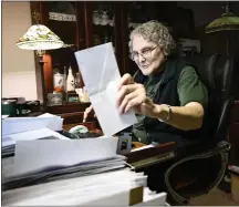  ?? ANDY CROSS — THE DENVER POST ?? Mary Buckingham logs one of thousands of letters requesting sourdough starter in the basement office at her home in Greeley.