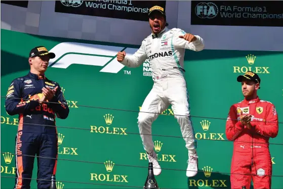  ?? FOTO: ANDREJ ISAKOVIC/AFP/LEHTIKUVA ?? Lewis Hamilton var den enda glada föraren på prispallen.