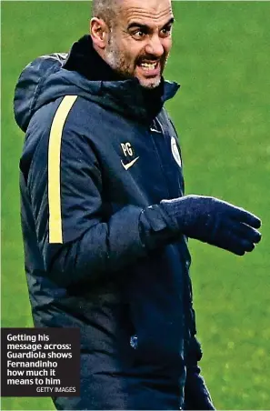  ?? GETTY IMAGES ?? Getting his message across: Guardiola shows Fernandinh­o how much it means to him