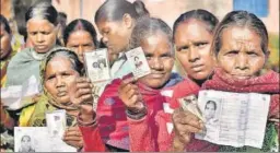  ?? PTI ?? Women wait to cast their votes in the Maoist-affected Kudu block of Jharkhand. >>P10