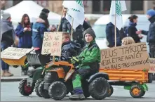  ?? FREDERICK FLORIN / AFP ?? Farmers’ children ride on pedal tractors in support of their parents’ strikes in Strasbourg, France, on Wednesday.