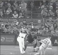  ?? Allen J. Schaben/Los Angeles Times/TNS ?? Dodgers designated hitter Shohei Ohtani hits his first home run off of Giants pitcher Taylor Rogers in the seventh inning at Dodger Stadium in Los Angeles on April 3.