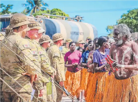  ?? Picture: Supplied. ?? Members of the Pormpuraaw Arts Centre Dance Group greet the Australian Army contingent during the AACAP 2021 opening ceremony.