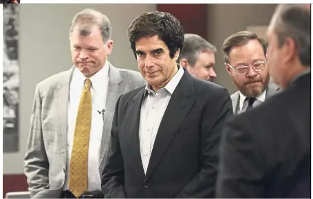  ??  ?? Mistake or missed step?: Copperfiel­d (centre) appearing at the Regional Justice Centre in Las Vegas before opening statements in a civil trial. — AP