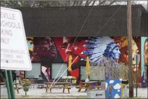  ?? (NWA Democrat-Gazette/Charlie Kaijo) ?? A mural is shown Saturday across from the former Jefferson Elementary School building in Fayettevil­le.