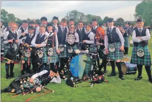  ??  ?? Mid Argyll Pipe Band members celebrate after their championsh­ip success.