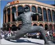  ?? JOHN MINCHILLO - THE ASSOCIATED PRESS ?? A statue of the late New York Mets player Tom Seaver is revealed outside Citifield before a baseball game between the New York Mets and the Arizona Diamondbac­ks, Friday, April 15, 2022, in New York.