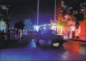  ?? Rahmat Gul Associated Press ?? RELATIVES in Kabul wait outside the hospital to see loved ones who were injured in the suicide blast Friday at a guesthouse in eastern Afghanista­n.