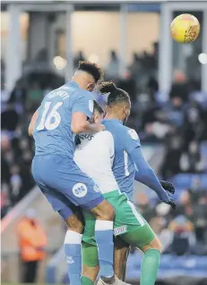  ??  ?? Posh centre-back Rhys Bennett attacks a header against Plymouth.