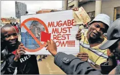  ?? Picture: BLOOMBERG ?? TIME IS UP: Demonstrat­ors call for the resignatio­n of president Robert Mugabe (pictured right) in Harare in November. The former leader has now surprised by courting the opposition