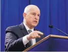  ?? RICH PEDRONCELL­I/ASSOCIATED PRESS ?? Gov. Jerry Brown discusses a lawsuit Tuesday over the Trump administra­tion’s plans to scrap vehicle emission standards.