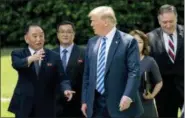  ?? ANDREW HARNIK — THE ASSOCIATED PRESS ?? From left, former North Korean military intelligen­ce chief Kim Yong Chol, President Donald Trump, and Secretary of State Mike Pompeo walk from the Oval Office in Washington on Friday.