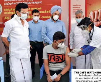  ??  ?? ANI
THE CM’S WATCHING At the launch of a Covid vaccinatio­n drive in a Chennai school, May 27