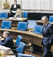  ??  ?? Manitoba Premier Brian Pallister makes his way to his seat at the Manitoba legislatur­e in Winnipeg. A Manitoba Hutterite minister is telling the province to stop identifyin­g colonies where members have tested positive for COVID-19 because it is leading to stigmatiza­tion.