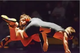  ?? SAM STEWART — DIGITAL FIRST MEDIA ?? Methacton’s Liam Donovan works to flip over Boyertown’s Chase Stehman during their bout at 113.