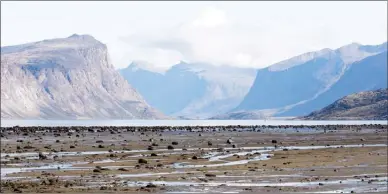  ?? ADRIAN WYLD/The Canadian Press ?? The is a view towards Cumberland Sound from the hamlet of Pangnirtun­g, Nunavut. Everyone thought things in this Nunavut community were finally been looking up. Pangnirtun­g, which once had one of the highest suicide rates in the territory, hadn't seen...