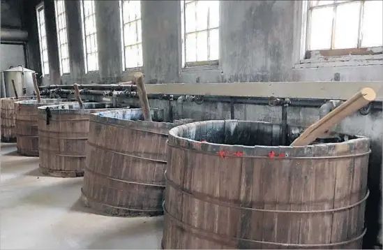  ?? Jody Jaffe ?? IN THE DYE HOUSE at Grovewood Village, vats and paddles from the 1920s are left as they were when the Asheville, N.C., compound was a center of textile activity.