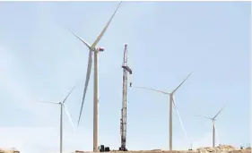  ??  ?? Installati­on of all 13 wind turbines at the Dhofar project site is due to be completed next month.