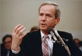  ?? LANA HARRIS — THE ASSOCIATED PRESS FILE ?? Former national security adviser Robert C. McFarlane gestures while testifying before the House-Senate panel investigat­ing the Iran-Contra affair on Capitol Hill in Washington, May 13, 1987. McFarlane, a top aide to President Ronald Reagan who pleaded guilty to charges for his role in an illegal arms-for-hostages deal known as the Iran-Contra affair, died May 12. He was 84.