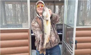  ?? ERIC VAN DYN HOVEN PHOTO ?? Eric Van Dyn Hovel of Kaukauna holds a walleye he caught on Lac Vieux Desert near Phelps. He said the fish weighed 16.87 pounds.