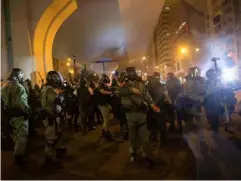  ?? (EPA/Jerome Favre) ?? Riot police move against protesters on Connaught Road West