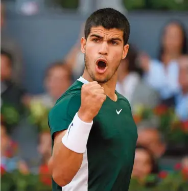  ?? (AFP) ?? Spain's Carlos Alcaraz celebrates a point against Germany's Alexander Zverev in the Madrid Open final on Sunday