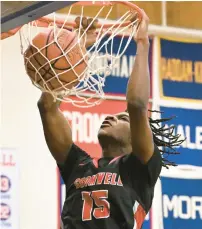  ?? CLOE POISSON/SPECIAL TO THE COURANT ?? Cromwell’s Victor Payne dunks for two of his career-high 42 points against Coginchaug in their game at Coginchaug Regional High School in Durham on Friday. Cromwell won, 76-45.