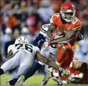  ?? JOHN SLEEZER / KANSAS CITY STAR ?? Chiefs rookie running back Kareem Hunt heads to the end zone for one of his two touchdowns against the Chargers on Saturday.