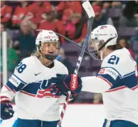  ?? NATHAN DENETTE/AP ?? United States forward Amanda Kessel (28) celebrates her goal with teammate Hilary Knight on Saturday during the first period against the Czech Republic in the semifinals of the women’s world hockey championsh­ips in Brampton, Ontario.