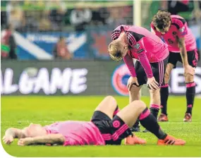  ??  ?? So near yet ... Gordon Strachan (right) and Leigh Griffiths, Barry Bannan and Charlie Mulgrew show the anguish of missing out on a World Cup play-off in Llubljana last Sunday