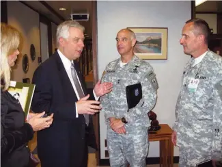  ??  ?? During a visit to Walter Reed Army Medical Center in Washington, D.C., Dolan meets with facility leaders, including Maj. Gen. David Rubenstein, center, the ACHE’s 2008-09 chairman and the Army’s deputy surgeon general at the time.