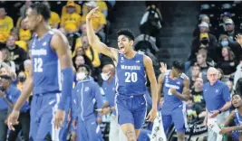  ?? TRAVIS HEYING The Wichita Eagle ?? Memphis forward Josh Minott — who was drafted by Charlotte on Thursday night and then dealt to Minnesota — celebrates a three-pointer against Wichita State last season.