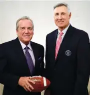  ?? THE ASSOCIATED PRESS ?? Brad Nessler, left, lead play-by-play announcer, and Gary Danielson, lead analyst, pose for a photo in New York on Tuesday. Nessler is the new voice of the SEC on CBS, taking over for Verne Lundquist, who had become an institutio­n on Saturday...