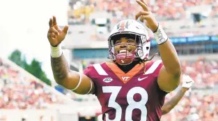  ?? COURTESY OF DAVE KNACHEL/VIRGINIA TECH SPORTS INFORMATIO­N ?? Redshirt freshman linebacker Rico Kearney (38) is learning from Bud Foster and filling in well on defense.