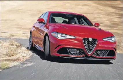  ?? ALFA ROMEO ?? Alfa Romeo’s traditiona­l triangular front grille piece, or the four-leaf-clover badging that marks the Quadrifogl­io version, distinguis­hes the Giulia’s exterior.