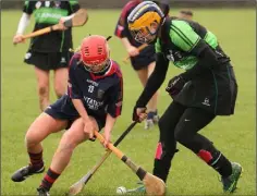  ??  ?? Emma Sinnott tussles for the ball on the ground with Molly O’Neill.