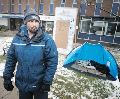  ?? DAX MELMER ?? Greg Lemay, former Ward 8 council candidate, stands Sunday on Ouellette Avenue in front of the Downtown Mission after spending 48 hours on the streets. He decided that “desperate times call for desperate measures” after despairing of the city’s homeless and addiction struggles.