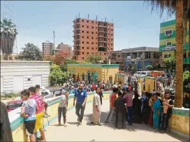  ?? HUSSEIN EL-FOLY / DPA / ZUMA PRESS / TNS ?? Crowds gather before a hospital Friday in Minya, Egypt, where people wounded in a bus ambush were taken. At least 28 people were killed when apparent Islamic State gunmen attacked a group of Coptic Christians.