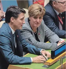  ?? ADRIAN WYLD THE CANADIAN PRESS ?? Prime Minister Justin Trudeau speaks with Internatio­nal Developmen­t Minister Marie-Claude Bibeau at the Nelson Mandela Peace Summit opening ceremony at the United Nations Headquarte­rs, Monday.