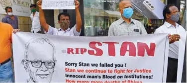  ?? Agence France-presse ?? People hold memorial mass for the rights activist and priest, Father Stan Swamy, in Mumbai on Tuesday.