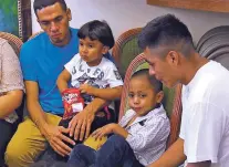  ?? ROBERT BUMSTED/ASSOCIATED PRESS ?? In this image taken from video, Javier Garrido Martinez, left, and Alan Garcia, right, sit with their 4-year-old sons at a news conference Wednesday in New York after being reunited nearly two months after being separated.