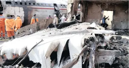  ?? |
Reuters ?? THE WRECKAGE of a Boeing 707 military cargo plane, which crashed to the west of the Iranian capital, close to Fath airport near Karaj, Iran yesterday. The decades-old plane was reportedly carrying meat from Kyrgyzstan and crashed while trying to land, killing 15 people on board and leaving a sole survivor. The crash of the jetliner marked the latest aviation disaster for Iran, which hoped to replace its ageing fleet under terms of the 2015 nuclear deal with world powers. However, President Donald Trump’s withdrawal from the accord in May scuttled billions of dollars in planned sales by Airbus and Boeing to the Islamic republic, increasing the danger for passengers in Iranian planes.