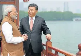  ?? AFP ?? Prime Minister Narendra Modi with Chinese President Xi Jinping during a round of informal talks between the two in Wuhan province of China on Saturday.
