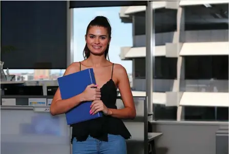  ?? PHOTO: AAP/DAVID CLARK ?? SUPER KEEN: Uni student Ashley Daykin from Brisbane works part-time at a law office and is keeping a close eye on her finances.