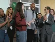  ?? ANTONIO PEREZ/CHICAGO TRIBUNE ?? Nigel Dandridge, co-founder and chief strategy officer of Ivy Hall, receives applause during the shop’s grand opening in Chicago on Nov. 14.